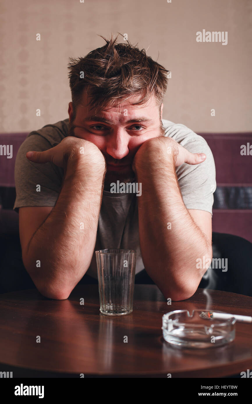 Depressed man after hard drinking Stock Photo Alamy