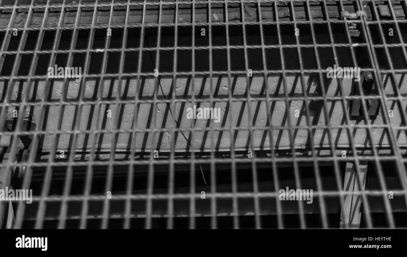 Shot of a grille/manhole in black and white Stock Photo