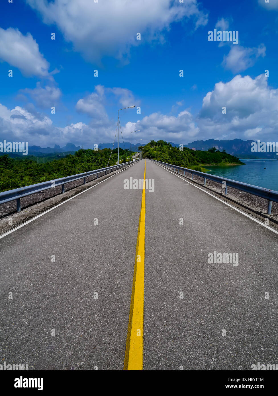 Road on Ratchaprapha Dam or Khao Sok Dam is in Surat Thani Province, Thailand Stock Photo