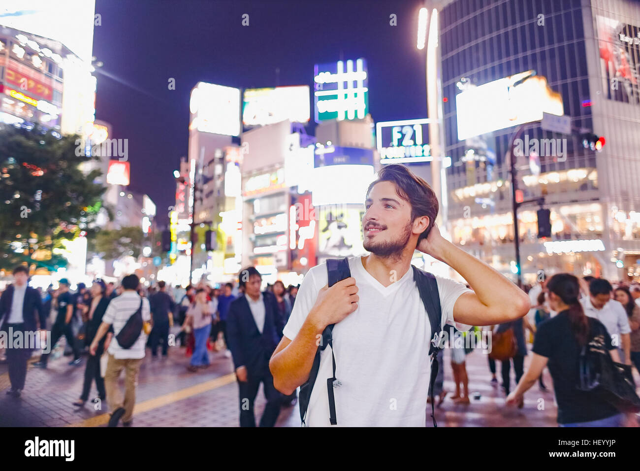 Caucasian man enjoying sightseeing in Tokyo, Japan Stock Photo