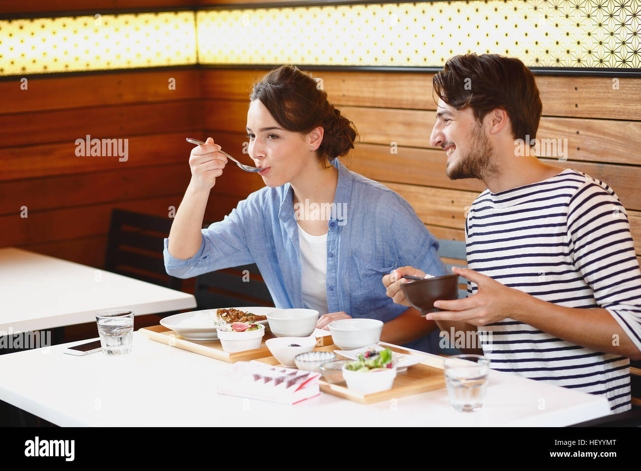 Caucasian couple enjoying Japanese food in Tokyo, Japan Stock Photo