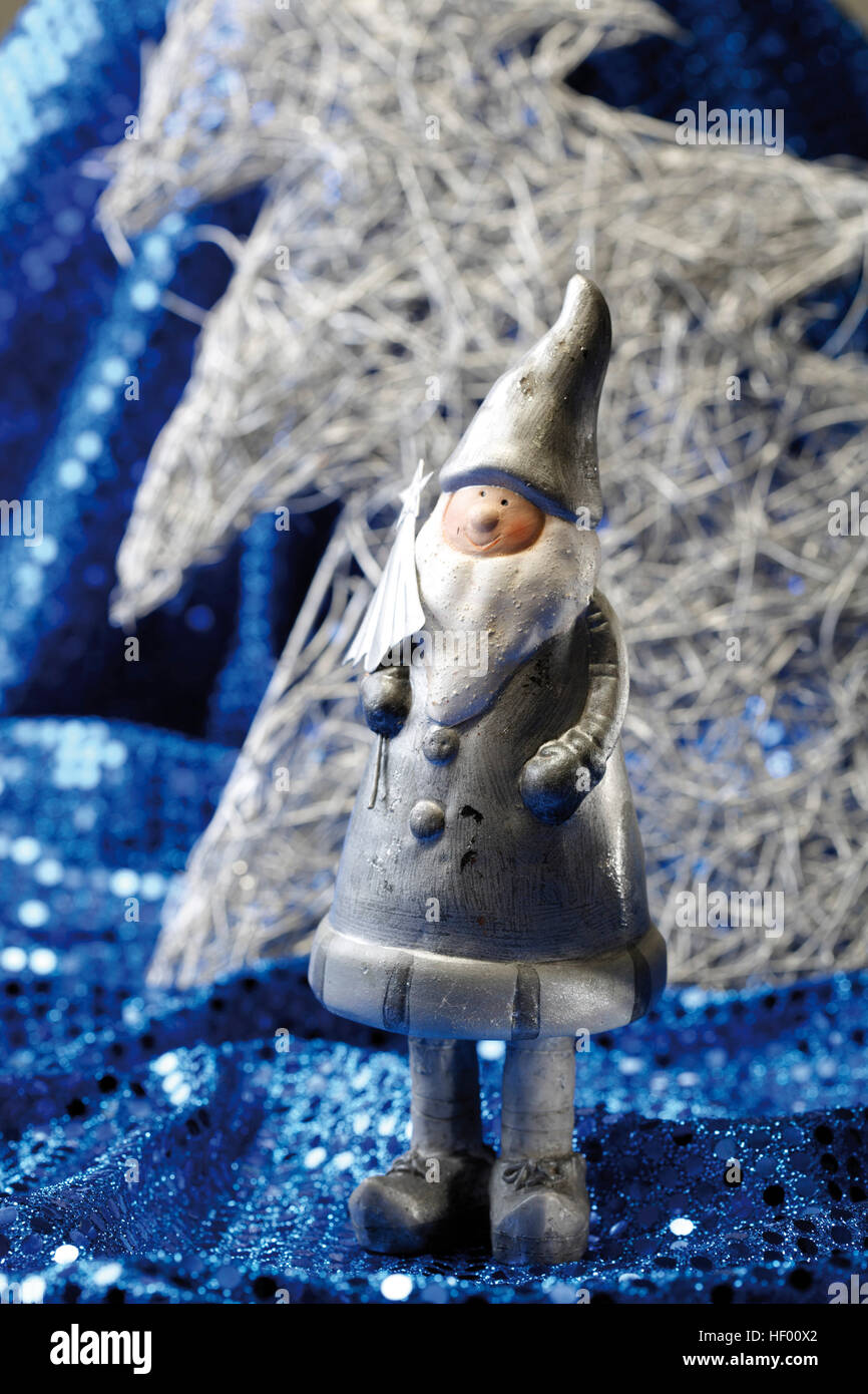 Silver Santa Silver Santa Claus figurine on blue sequined material, Christmas ...