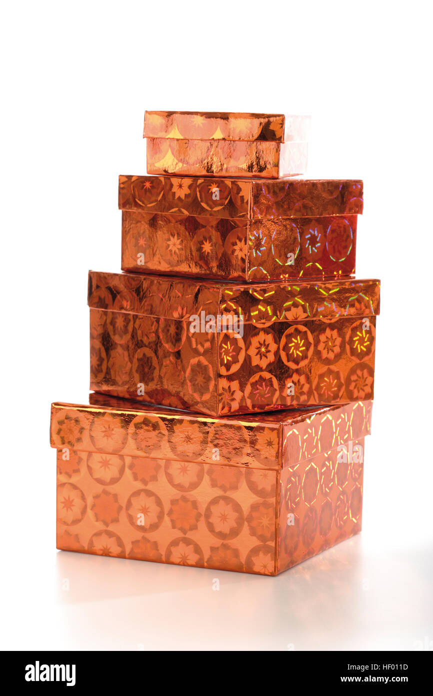 Four coppercoloured gift boxes, stacked Stock Photo Alamy