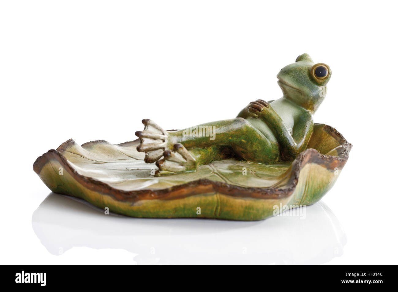 Decor, frog laying back on lotus leaf Stock Photo - Alamy