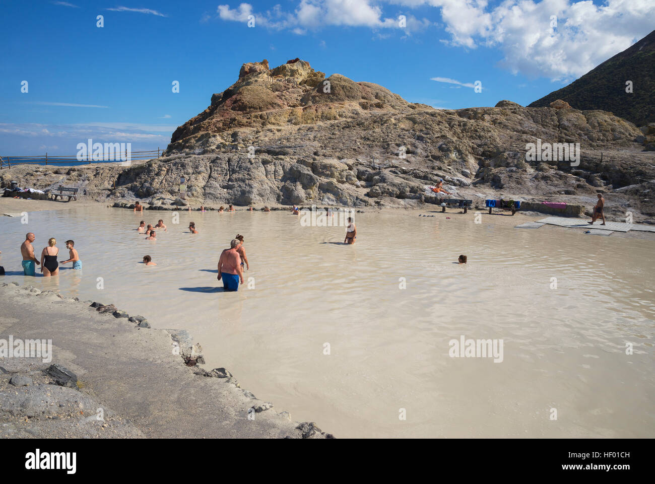 Bathers enjoying volcanic mud, hot springs, Vulcano Island, Aeolian