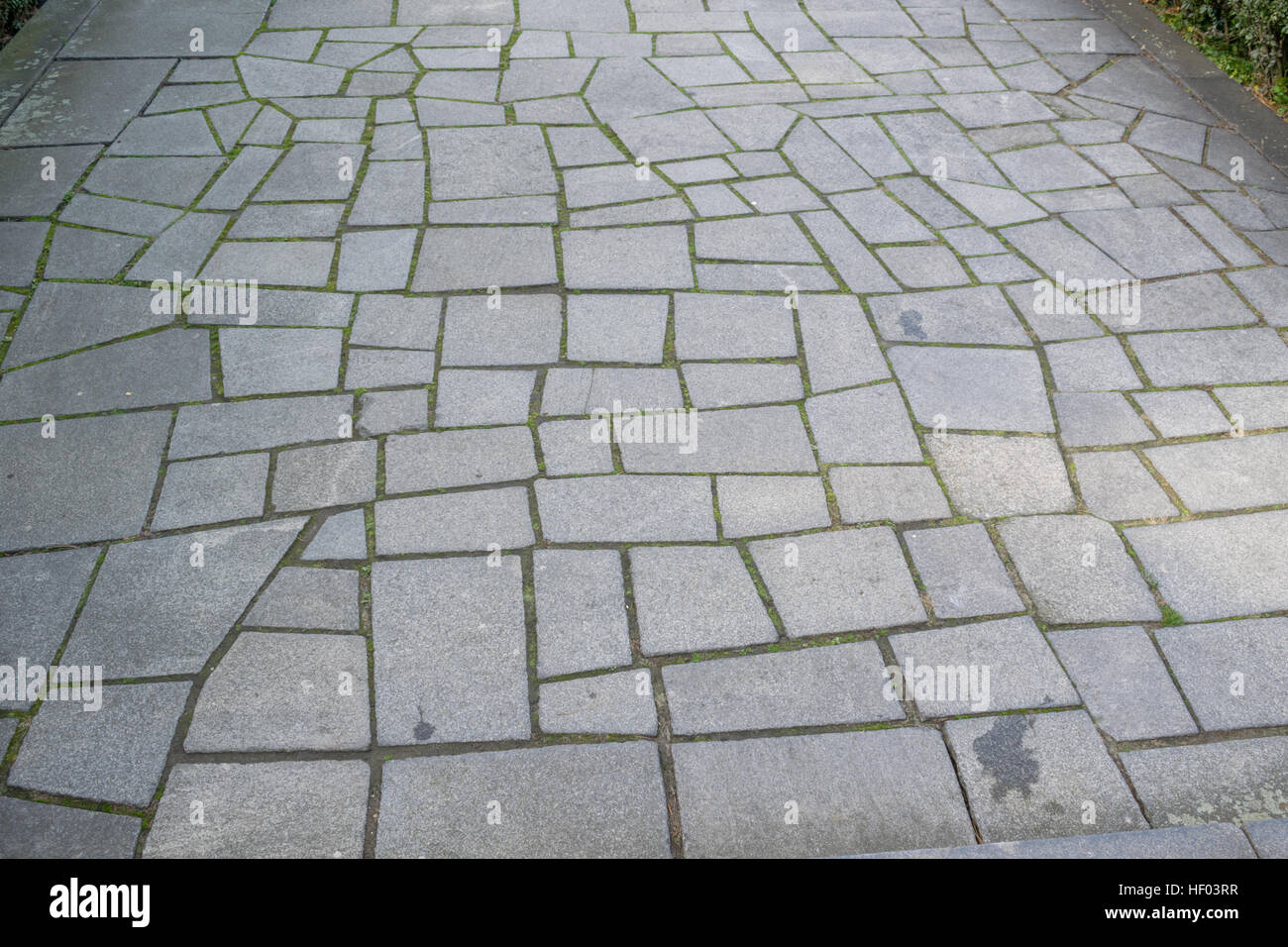 Granite tile asymmetrical walkway pattern Stock Photo