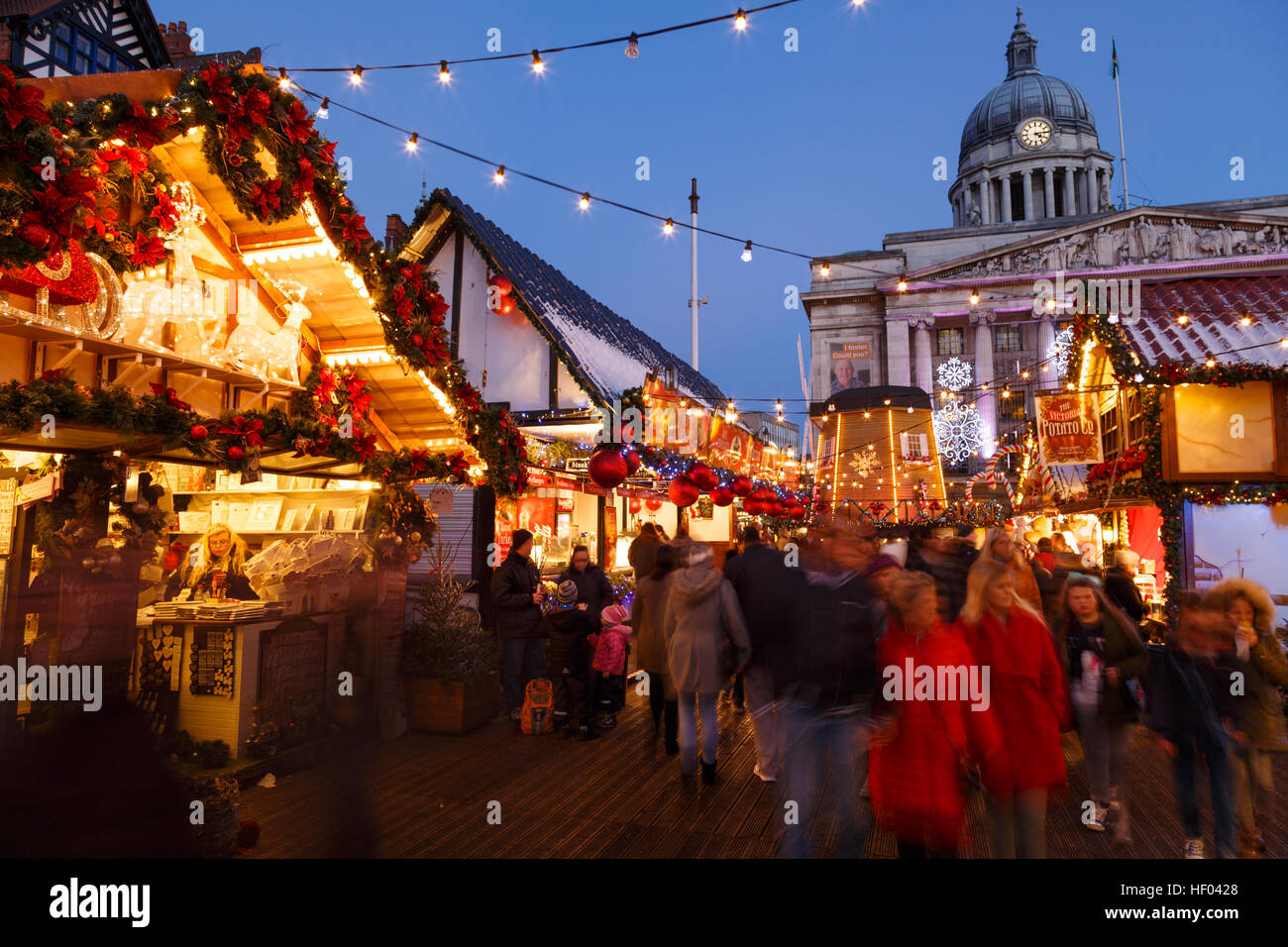 Families enjoying Nottingham Christmas Market in the evening. In