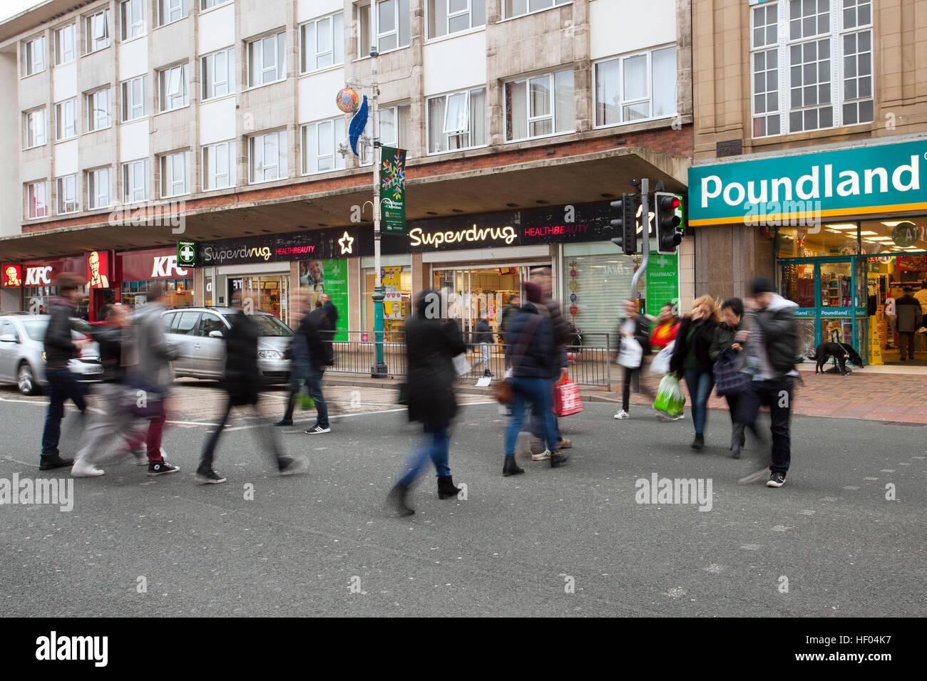 Poundland, Southport, Merseyside, UK. 24th December, 2016. Pre Boxing Day Sales.   Stores in the town are now displaying tentative sale signs and some plan early closing as they prepare for a Sales Bonanza in the next 48 hours. Last minute shoppers are taking advantage of discounts of up to 50% on selected goods. Credit: MediaWorldImages/Alamy Live News Stock Photo