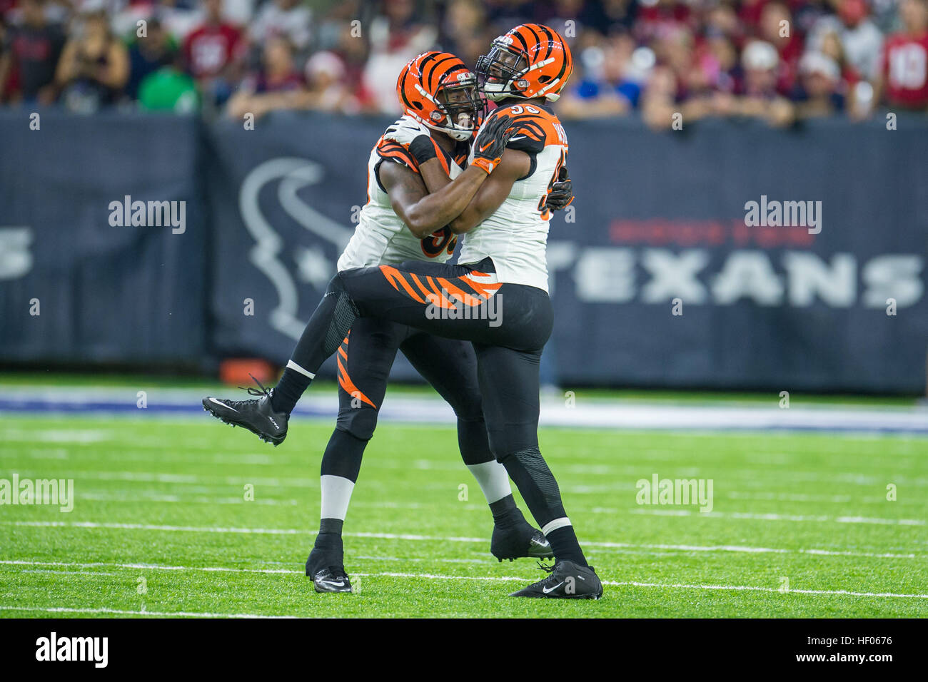 Houston, Texas, USA. 24th Dec, 2016. Cincinnati Bengals defensive end Michael Johnson (90) and Cincinnati Bengals defensive end Wallace Gilberry (95) celebrate a sack during the 1st quarter of an NFL game between the Houston Texans and the Cincinnati Bengals at NRG Stadium in Houston, TX on December 24th, 2016. © Trask Smith/ZUMA Wire/Alamy Live News Stock Photo