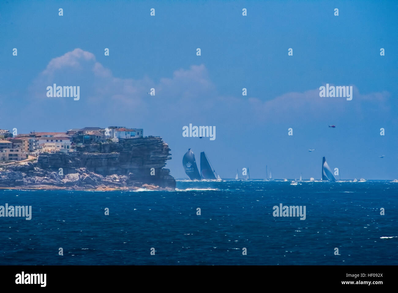 Sydney, Australia. 26th December, 2016. Photo taken from Maroubra headlands showing the front runners of the Sydney to Hobart supermaxi yacht group clearing Ben Buckler Headland at Bondi on their way south to Hobart © Simonito Tecson/Alamy Live News Stock Photo