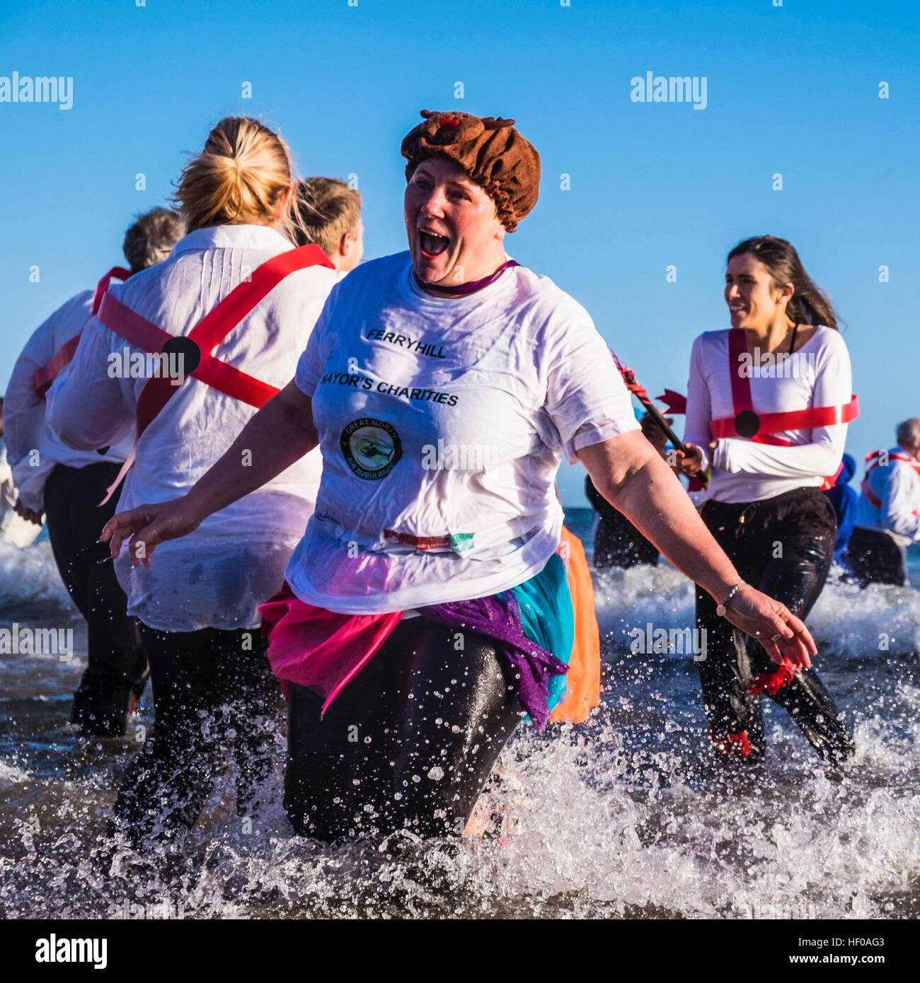 Hardy souls take to the North Sea in fancy dress in Sunderland's annual Boxing Day Dip. The dip is arranged by the Sunderland Lions Club and raises money for charity. (c) Paul Swinney/Alamy Live News Stock Photo