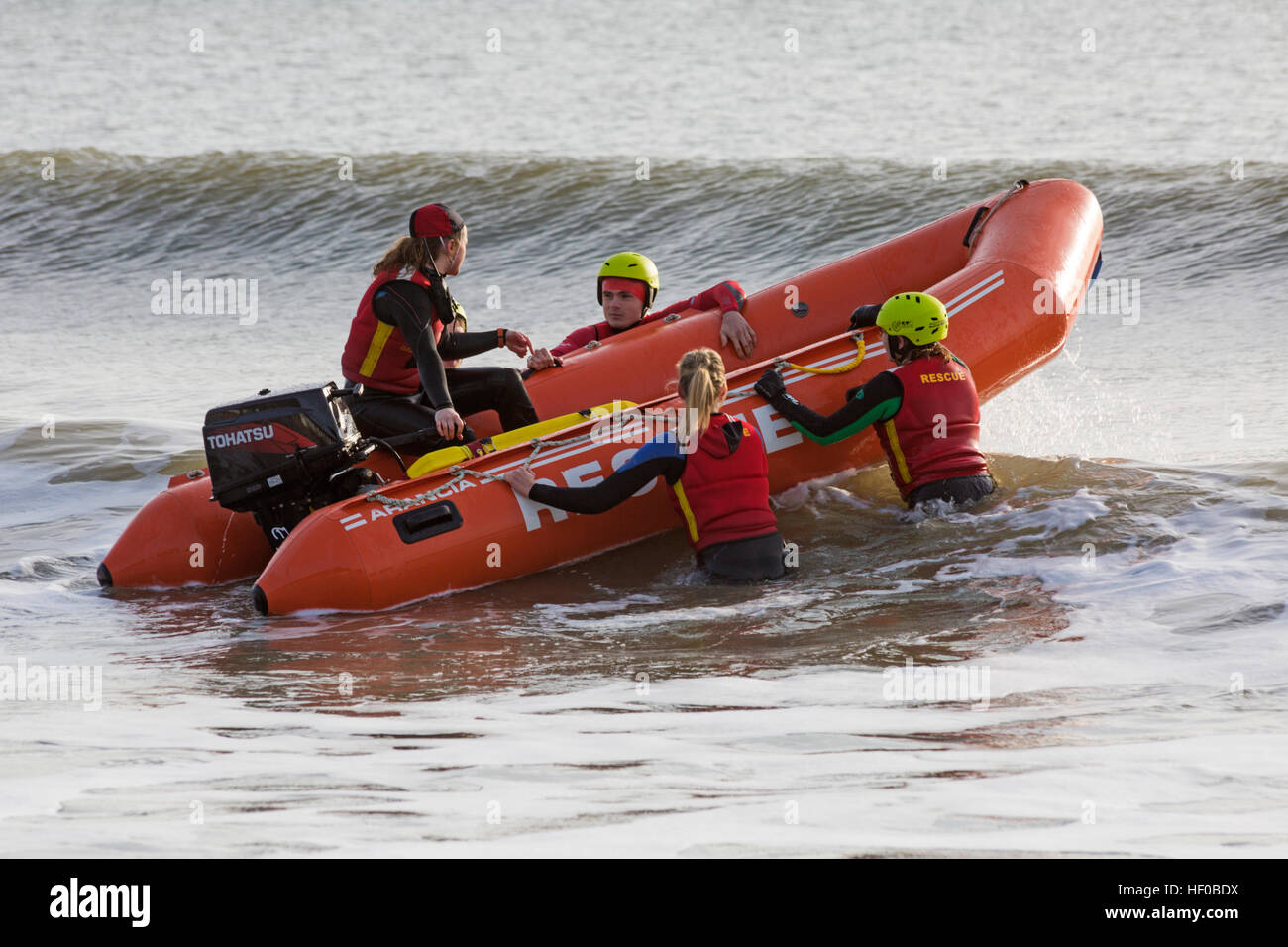 Durley Chine, Bournemouth, Dorset, UK. 26 December 2016. Bournemouth Lifeguard Corps give a demonstration of their lifesaving skills in the sea. The Corps, founded in 1965, is one of the largest and most successful volunteer lifeguard clubs in the UK with more than 100 members aged from 7 to 70. Credit: Carolyn Jenkins/Alamy Live News Stock Photo