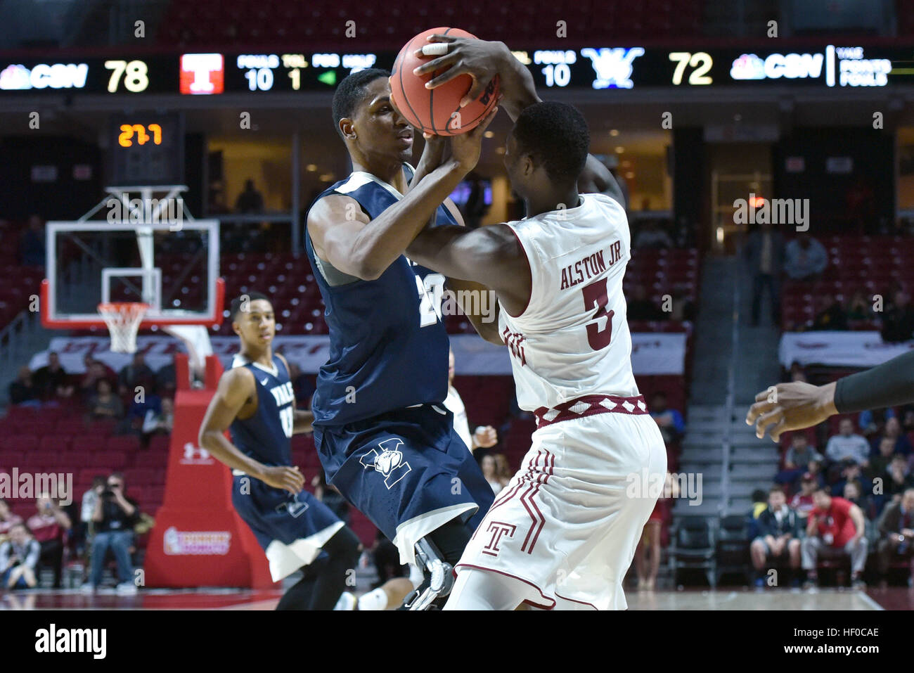 Philadelphia, Pennsylvania, USA. 22nd Dec, 2016. Yale Bulldogs forward JORDAN BRUNER (23) reaches in to tie up Temple Owls guard SHIZZ ALSTON JR. (3) during the basketball game being played at the Liacouras Center in Philadelphia. Temple beat Yale 83-77. © Ken Inness/ZUMA Wire/Alamy Live News Stock Photo