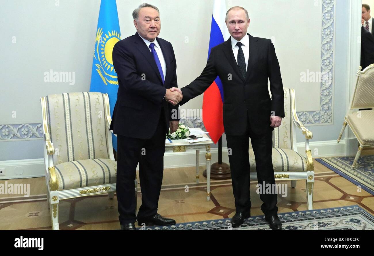Russian President Vladimir Putin greets Kazakh President Nursultan ...