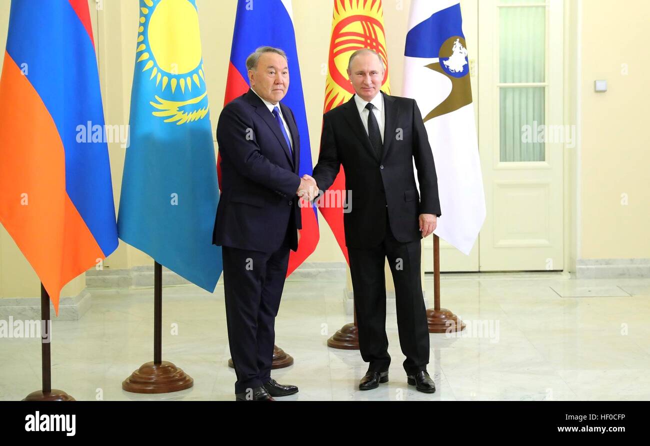 Russian President Vladimir Putin greets Kazakh President Nursultan ...