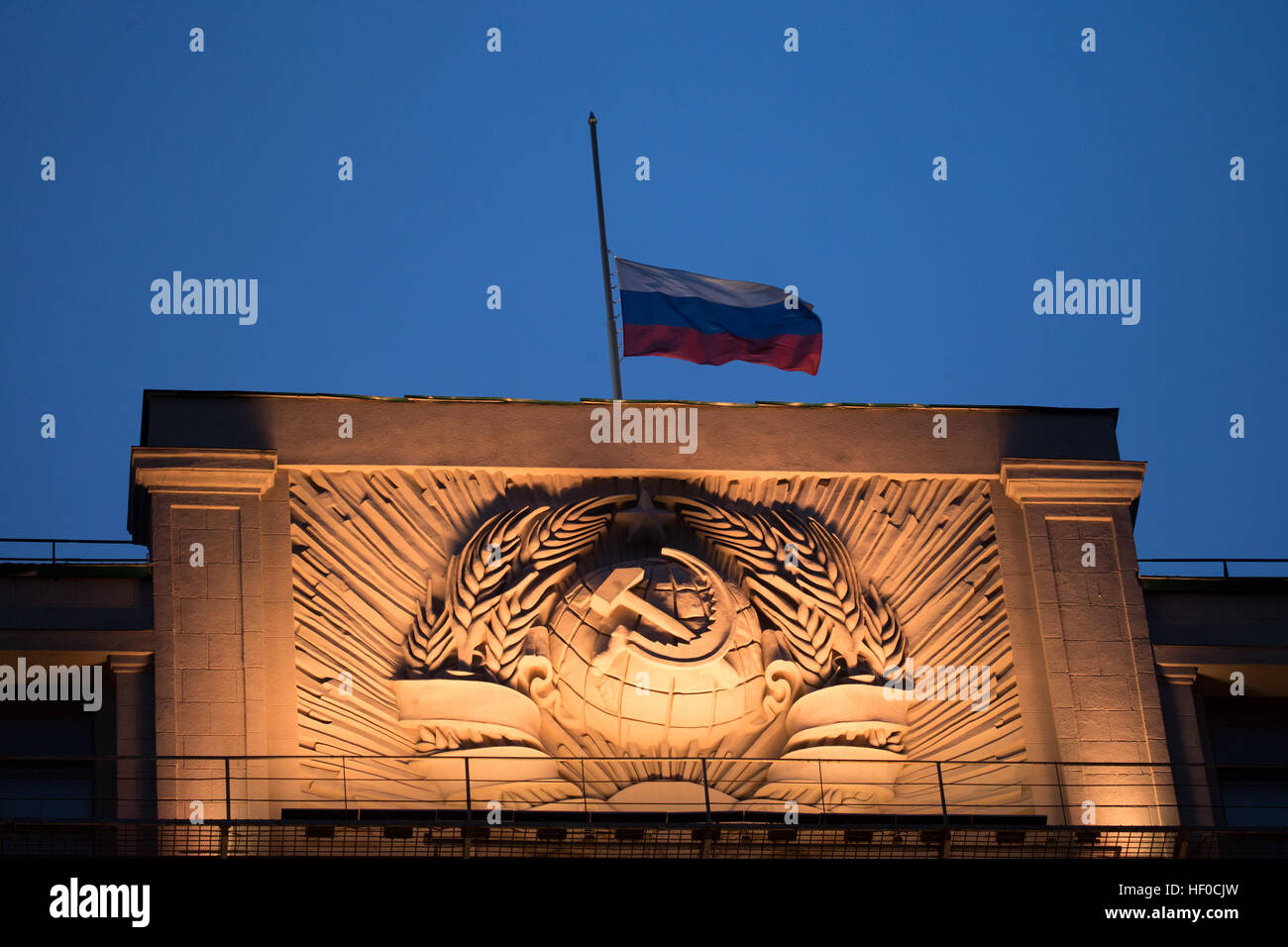 MOSCOW, RUSSIA - DECEMBER 26, 2016: A Russian flag flying at half-mast above the Russian State Duma building as Russia's President Vladimir Putin declares December 26, 2016 the Day of National Mourning for the victims of the Tupolev Tu-154 plane crash off Sochi coastline a day earlier. The plane of Russia's Defence Ministry bound for Russia's Hmeymim air base in Syria, was carrying members of the Alexandrov Ensemble, Russian servicemen and journalists, and Yelizaveta Glinka (known as Doctor Liza), Spravedlivaya Pomoshch [Just Aid] International Public Organisation director. Stock Photo