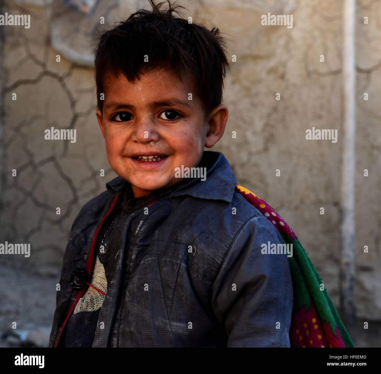 Qalat, Afghanistan's Zabul province. 26th Dec, 2016. An Afghan displaced child stands outside his tent in Qalat city, capital of southern Afghanistan's Zabul province, Dec. 26, 2016. More than one million people have to flee their home due to conflicts in the country, according to officials. © Sanaullah Seiam/Xinhua/Alamy Live News Stock Photo