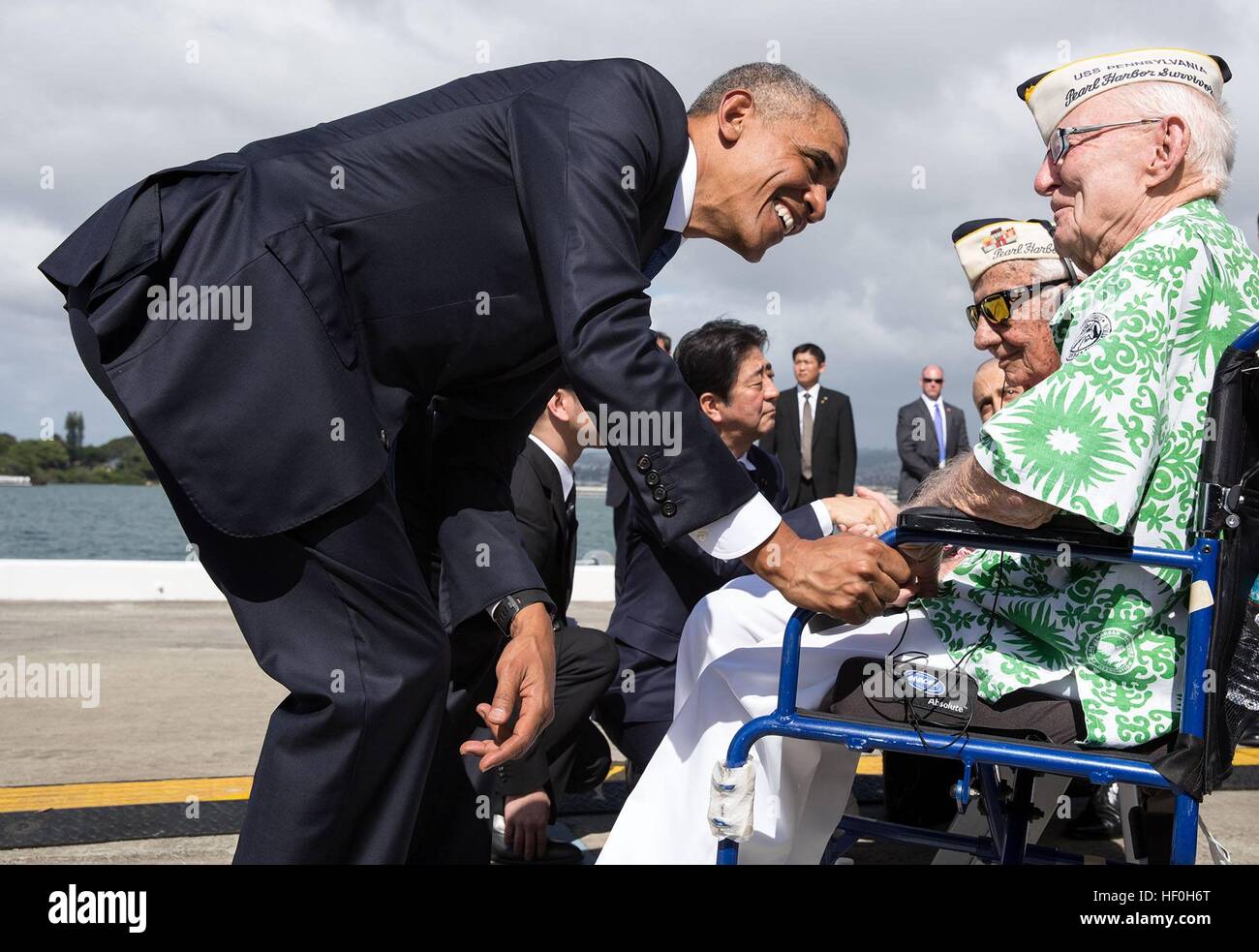 Pearl Harbour, Hawaii. 27th Dec, 2016. U.S President Barack Obama and Japanese Prime Minister Shinzo Abe greet Pearl Harbor survivors from foreground, Everett Hyland, Al Rodrigues, and Sterling Cale following their speeches at the Pearl Harbor Memorial December 27, 2016 in Pearl Harbor, Hawaii. Abe is the first Japanese leader to publicly view the site of the Pearl Harbor Attack. Credit: Planetpix/Alamy Live News Stock Photo