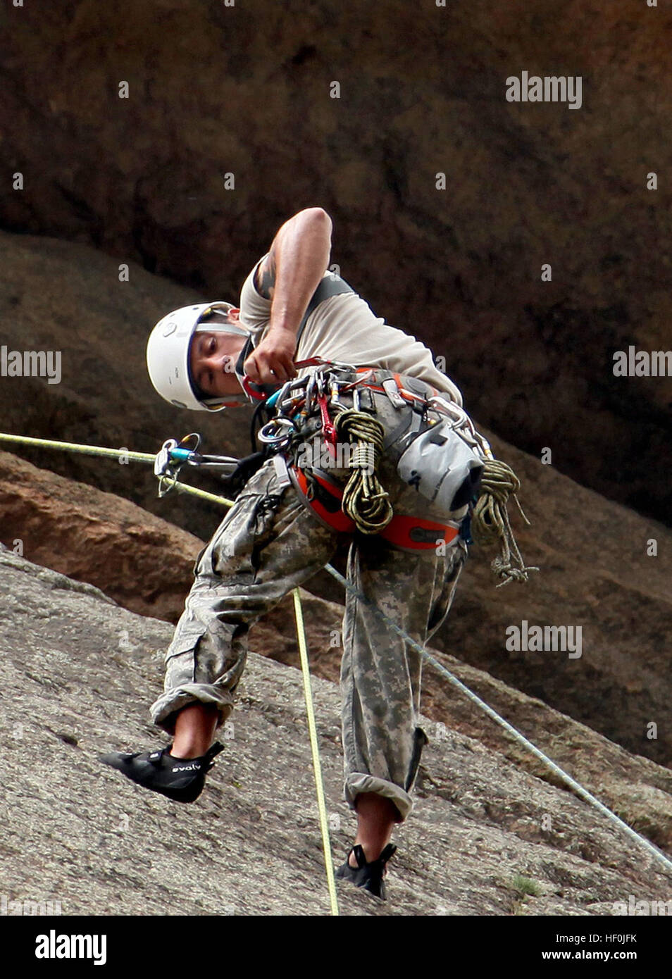 Soldiers attending the U.S. Army Special Forces Command (A) Mountaineering Program conduct Senior Course Level II  training near Fort Carson, Colo., after completing the Basic Course (Level III) where team members learned 15 basic tasks, including navigating in mountainous terrain, rope commands, transportation of a casualty on an improvised litter and rappelling techniques. During Level II, the soldiers are expected to know and pass a hands-on test on the basic fundamentals of rock climbing throughout the course. Among the 17 tasks in the Senior Course they must be proficient at constructing  Stock Photo