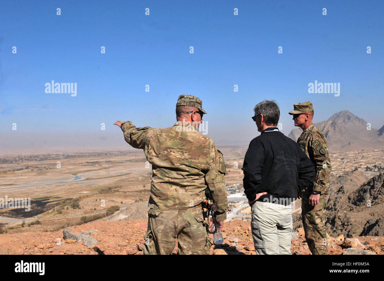 Col. Todd Wood, commander of the 1st Stryker Brigade Combat Team, 25th Infantry Division, and Command Sgt. Maj. Bernie Knight show Secretary of the Army John M. McHugh the view overlooking Panjwa'i district from Forward Operating Base Masum Ghar Dec. 14. Secretary of the Army visits Panjwa'i, Afghanistan 111214-A-AX238-001 Stock Photo
