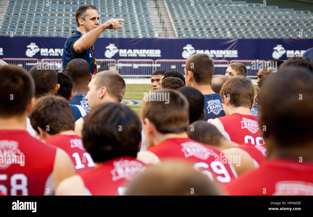 Creig Federico, former Detroit Lions football player, gives a motivational talk to high school football players at the Junior Rank Proving Ground Combine at Chase Field in Phoenix, Ariz., Jan. 2. During the event, players competed in various athletic challenges to earn a spot on the roster for the Semper Fidelis All-American Bowl in 2013. The inaugural Semper Fidelis All-American Bowl, hosted by the Marine Corps and Junior Rank, will feature the nation’s top 100 football players, at Chase Field Jan. 3. High school juniors compete to be among the best at the USMC Proving Ground Combine 120102-M Stock Photo
