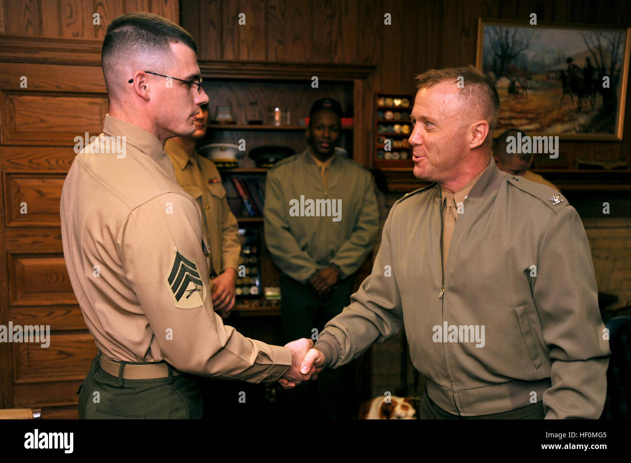 Col. Paul D. Montanus, Marine Barracks Washington commanding officer, congratulates Sgt. Timothy Spreder after announcing Spreder as the next color sergeant of the Marine Corps at Marine Barracks Washington Dec. 6. The 25-year-old native of Florence, Ky., graduated from Simon Kenton High School in 2003 and joined the Marine Corps that summer. Not only does the color sergeant of the Marine Corps bear the nation’s flag, but he is also the senior sergeant in the Corps. Florence man selected as next color sergeant of the Marine Corps 120106-M-HZ646-001 Stock Photo