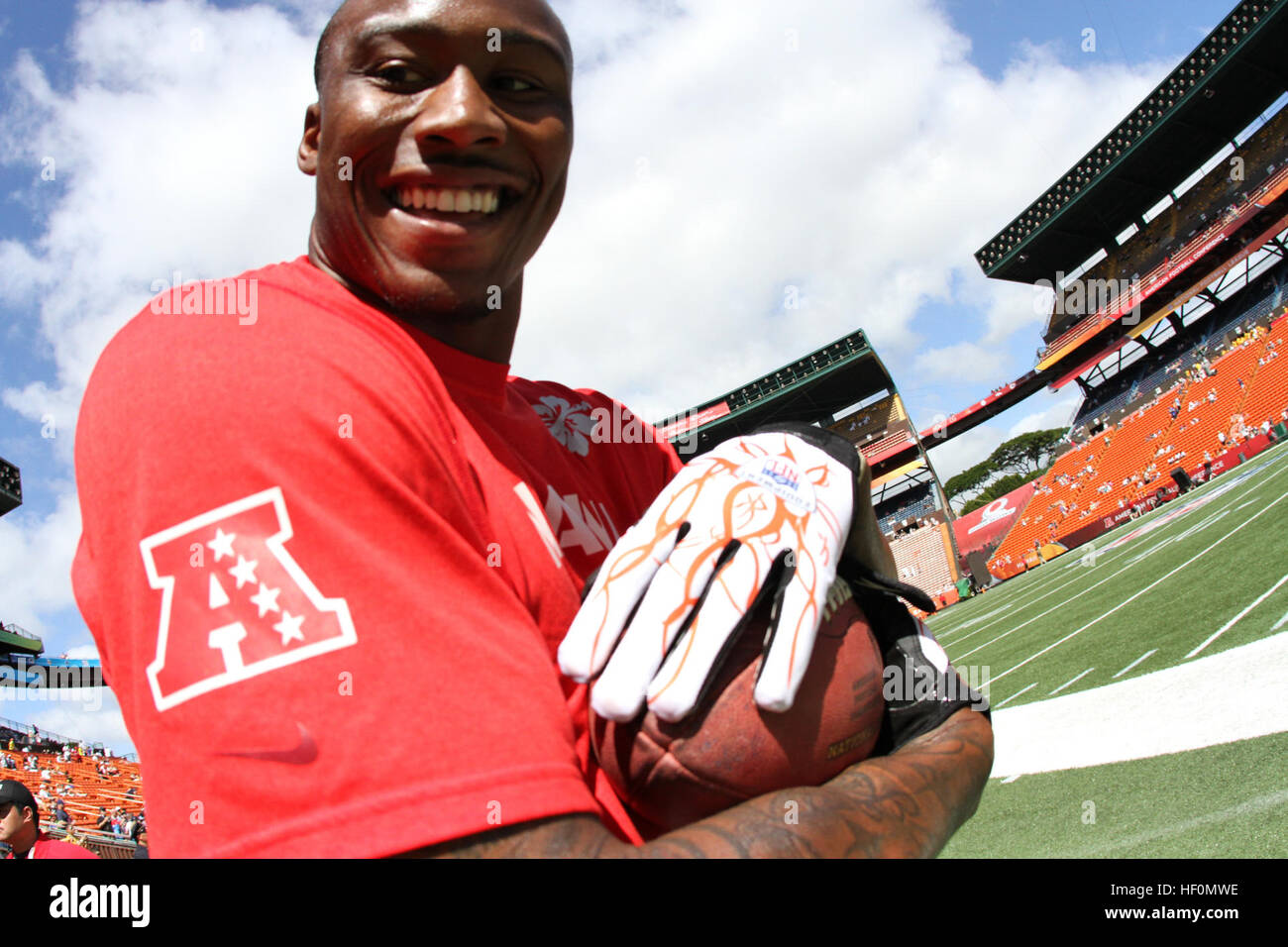 Miami Dolphins wide receiver Brandon Marshall smiles after making a reception during pregame warm up at the Aloha Stadium during National Football League's 2012 Pro Bowl game in Honolulu, Hawaii, Jan. 29, 2012. Brandon Marshall smile Stock Photo