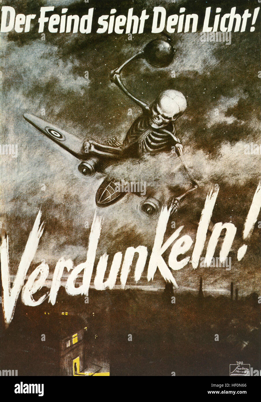 "THE ENEMY SEES YOUR LIGHT !  GO DARK !"  German air raid warning poster about 1943 Stock Photo