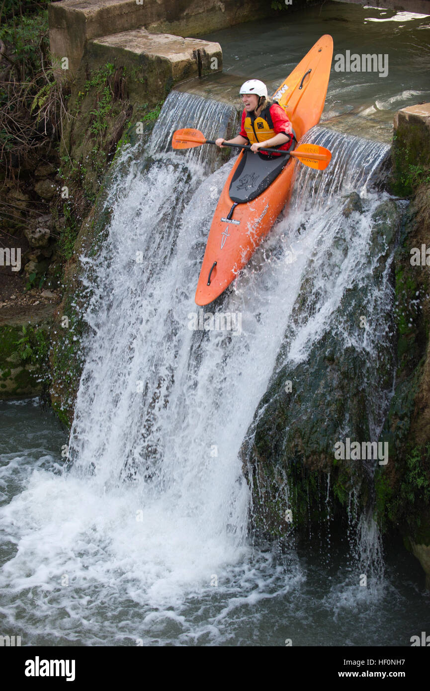 SAN MARCOS, Texas -- U.S. Air Force Airman 1st Class Mari Mosteller, 49th Wing public affairs, launches her boat off of a 15-foot waterfall here Feb. 19.  Learning how to manage the stress and anxiety of launching a boat off of a 15-foot waterfall helped Airmen a spouse and a civilian participating in the Holloman Outdoor Wingman Program to understand the manageability of stress in everyday life situations. Each Airman, spouse and civilian walked away with a better understanding of both how to handle themselves on a waterfall and how to cope through the stress of work in a healthy way. (U.S. A Stock Photo