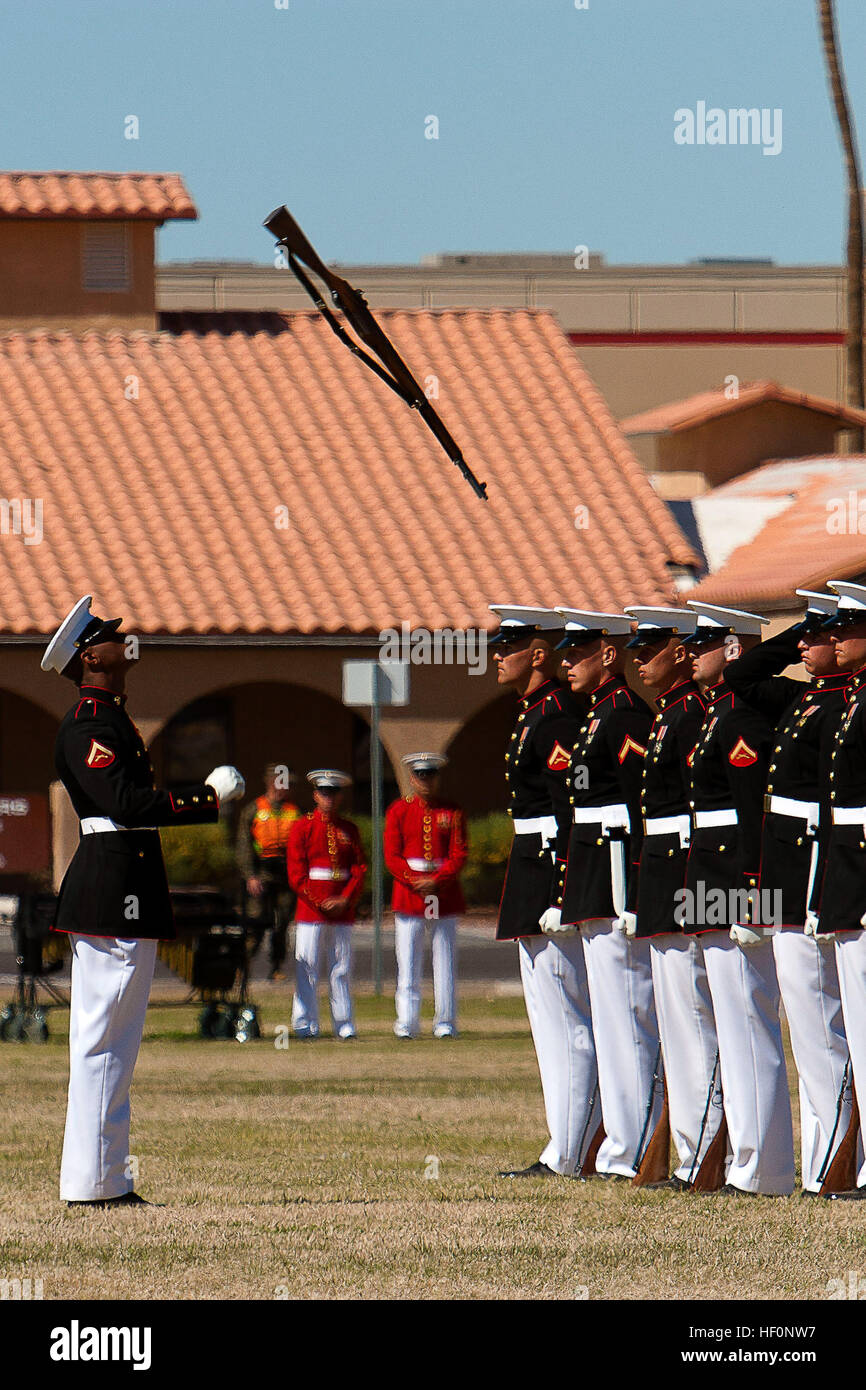 Lance Cpl. Carlton Williams, the Marine Corps Silent Drill Platoon rifle inspector, prepares to catch an M1 Garand rifle during a Battle Color Detachment ceremony at Marine Corps Air Station Yuma, Ariz., March 1, 2012. The Battle Color Detachment, composed by silent drill platoon, the U.S. Marine Drum and Bugle Corps and Marine Corps Color Guard, is currently on its national installation tour. Battle Color Detachment kicks off tour 120301-M-RT059-616 Stock Photo
