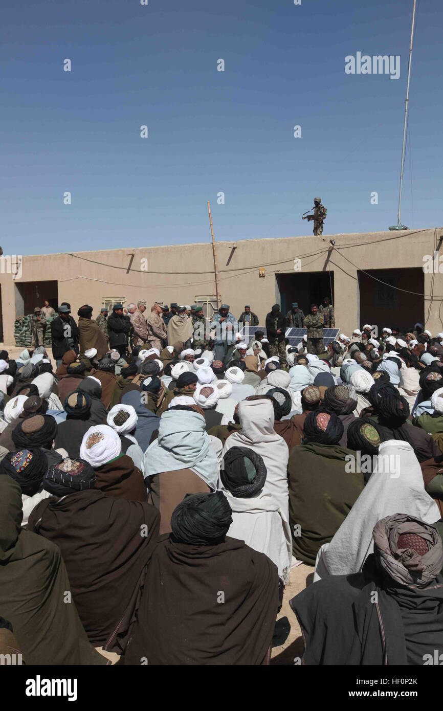 An Afghan Uniformed Police commander and U.S. Marines with Echo Company, 2nd Battalion, 5th Marine Regiment, Regimental Combat Team 6 speak with men from the local area during a shura in Regay, Musa Qa'leh, Helmand province, Afghanistan, March 12, 2012. The commander addressed the recent transition of responsibilities in the area between Marines of 2nd Battalion, 5th Marine Regiment, RCT-6 and 2nd Battalion, 4th Marines Regiment, RCT-6. (U.S. Marine Corps photo by Lance Cpl. Stephen A. Wagner) Enduring Freedom 120312-M-LW625-045 Stock Photo