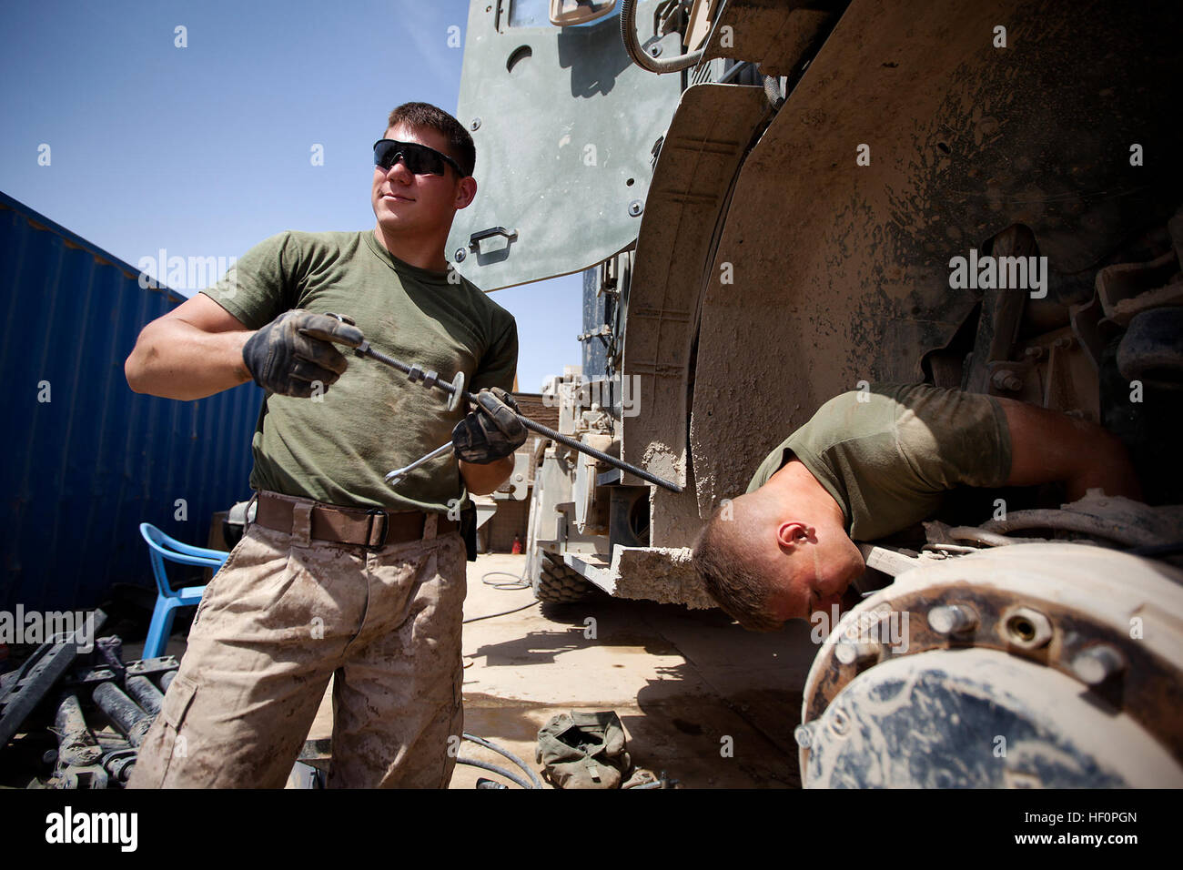 U.S. Marine Cpl. Eifert (left), a wrecker operator with Trucks