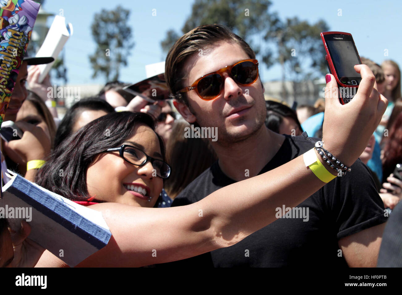 Zac Efron signed autographs and took photos with fans abroad Camp Pendleton before the premier release of his latest film, The Lucky One, at the base Bulldog Box Office movie theater, April 14. The young actor, best known for his role in The High School Musical trilogy, was accompanied by co-star Taylor Schilling and the film's director Scott Hicks. The Lucky One is scheduled for release April 20. Zac Efron at Marine Corps Base Camp Pendleton, CA Stock Photo