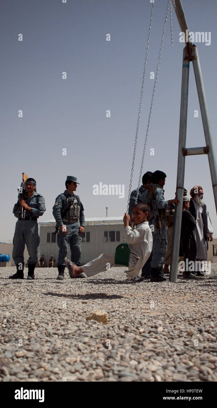 An Afghan Child Tries Out A New Swing At The Delaram Boy S