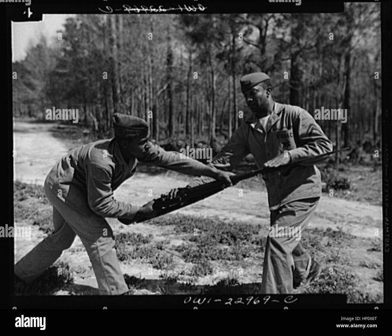 Cpl. Arvin L. Ghazlo demonstrates to a bayonet class a technique for disarming the enemy. Breaking a tradition of 167 years, the Marine Corps started enlisting blacks, June 1, 1942. The first class of 1,200 black volunteers began their training three months later as members of the 51st Composite Defense Battalion at Montford Point, a section of the 200-square-miles of Marine Corps Base Camp Lejeune, N.C. Montford Point Marines 420601-M-XX999-001 Stock Photo