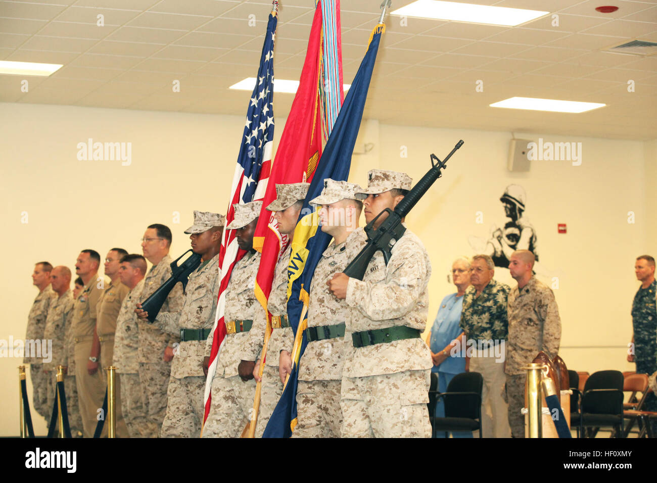 The Marine Corps Combat Service Support Schools' Color Guard march to the front of the quarterdeck during the Field Medical Training Battalion- East Change of Command ceremony aboard Camp Johnson N.C., July 27, 2012.The Change of Command ceremony is a time honored tradition which formally restates the continuity of authority to the personnel of the command. (U.S. Marine Corps Photo by Lance Cpl. Holly A. Williams/Released) PAS change of command 120727-M-IA102-019 Stock Photo