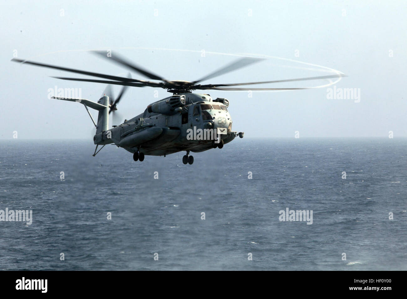 USS NEW YORK, INDIAN OCEAN (August 7, 2012) – A CH-53E Sea Stallion with Marine Medium Tiltrotor Squadron 261 (Reinforced), 24th Marine Expeditionary Unit, prepares to the land on the flight deck of the USS New York during routine flight operations, Aug. 7, 2012. The 24th MEU is deployed with the Iwo Jima Amphibious Ready Group as a U.S. Central Command theater reserve force providing support for maritime security operations and theater security cooperation efforts in the U.S. 5th Fleet area of responsibility. (Official Marine Corps photo by Staff Sgt. Robert L. Fisher III) 24th MEU deployment Stock Photo