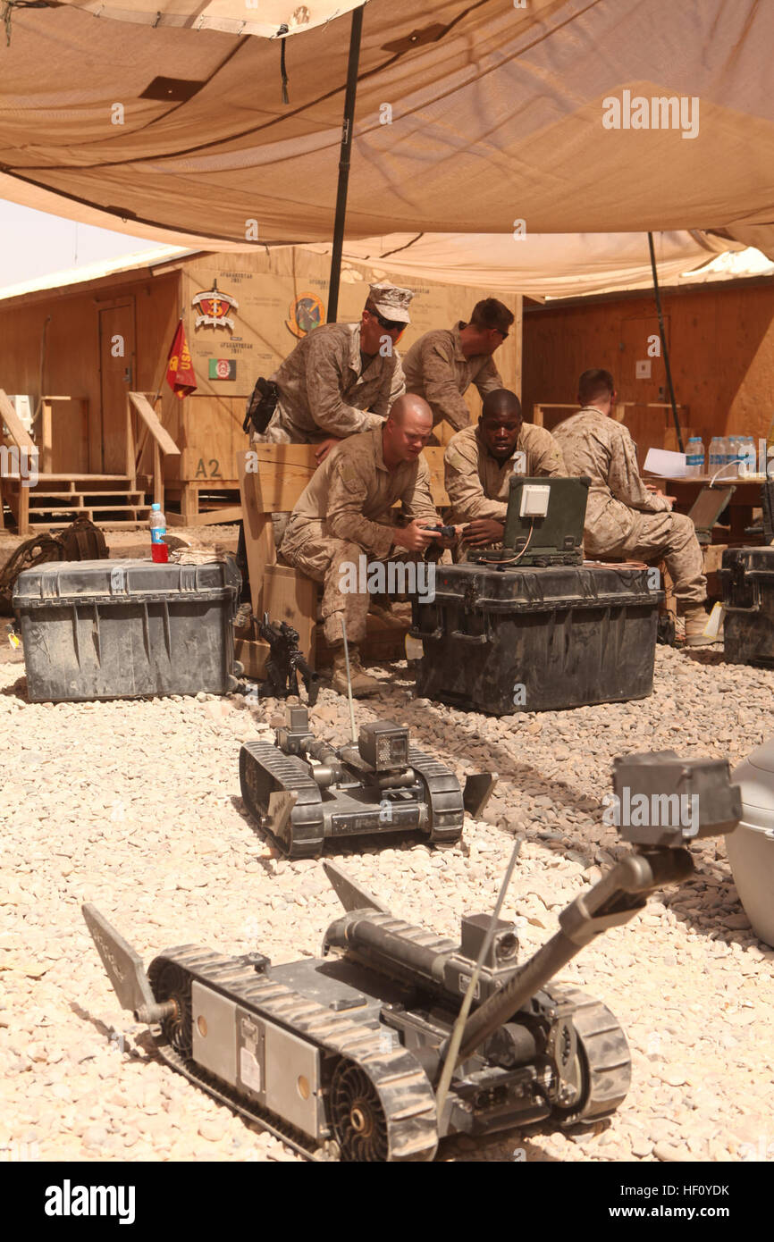 U.S. Marines with 3rd Battalion, 8th Marine Regiment, Regimental Combat Team 6 operate a PACKBOT-510, an improvised explosive device (IED) disarming robot, as part of a class on Forward Operating Base Geronimo, Helmand province, Afghanistan Aug. 28, 2012. Marines conducted the robot training in order to handle IEDs from a safe distance. (U.S. Marine Corps photo by Lance Cpl. Cesar N. Contreras/Released) PACKBOT-510 120828-M-PO905-021 Stock Photo