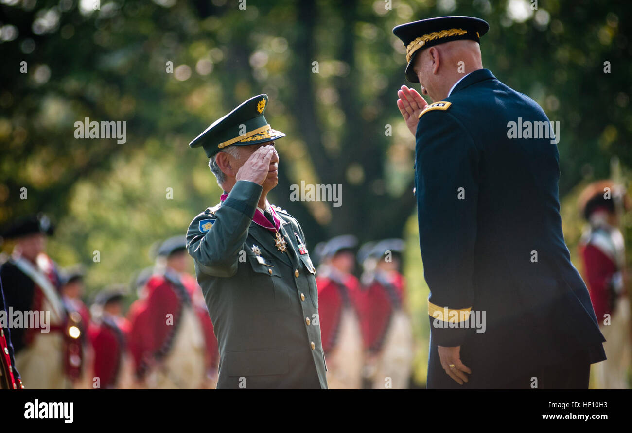 Japanese Ground Self-Defense Force Chief of Staff Gen. Eiji Kimizuka salutes U.S. Army Chief of Staff Gen. Raymond T. Odierno after Odierno awards him with the Legion of Merit (Degree of Commander), Sept. 27, 2012, at Joint Base Myer-Henderson Hall, Va. Kimizuka received the award for promoting family welfare through the development of a Japan Ground Self-Defense Force family support structure. Senior leader from Land of the Rising Sun visits National Capital Region 120927-A-AJ780-004 Stock Photo