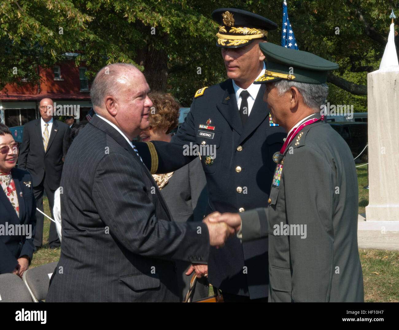 Under Secretary of the Army Joseph W. Westphal (left) welcomes Japanese Ground Self-Defense Force Chief of Staff Gen. Eiji Kimizuka (right), along with U.S. Army Chief of Staff Gen. Raymond T. Odierno (middle) during Kimizuka's award ceremony, Sept. 27, 2012, Joint Base Myer-Henderson Hall, Va. Gen. Kimizuka received the award for promoting family welfare through the development a Japan Ground Self-Defense Force family support structure. Senior leader from Land of the Rising Sun visits National Capital Region 120927-A-AJ780-013 Stock Photo