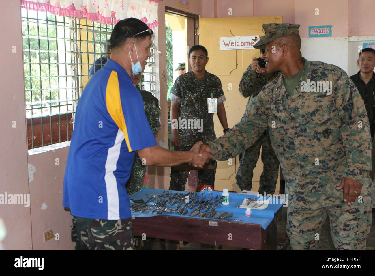 Lt. Col. Renato L. Aguila shakes hands with Brig. Gen. Craig Q. Timberlake Oct. 10 during Philippine Bilateral Amphibious Landing Exercise 2013 on the island of Palawan. PHIBLEX 2013 is a bilateral training exercise hosted annually in the Republic of the Philippines to enhance interoperability and readiness of Armed Forces of the Philippines and U.S. Forces. Service members from the Philippines and the U.S. will spend the duration of PHIBLEX building a pavilion together here at the school as well as providing medical and dental care. Timberlake is the commanding general of the 3rd Marine Exped Stock Photo