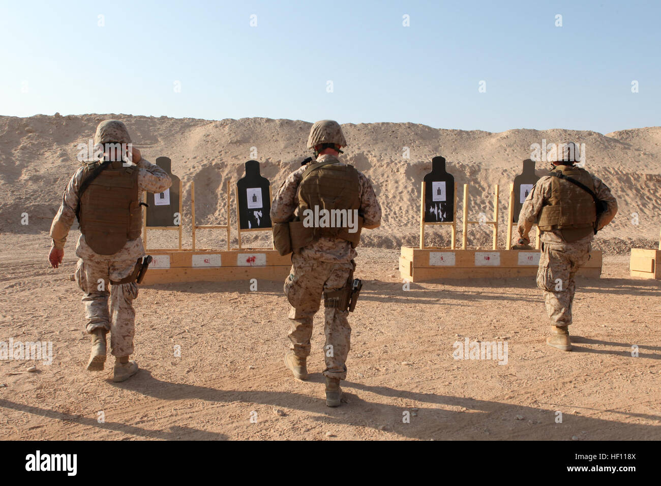 U.S. Marines with 3rd Marine Aircraft Wing (Forward) assess their