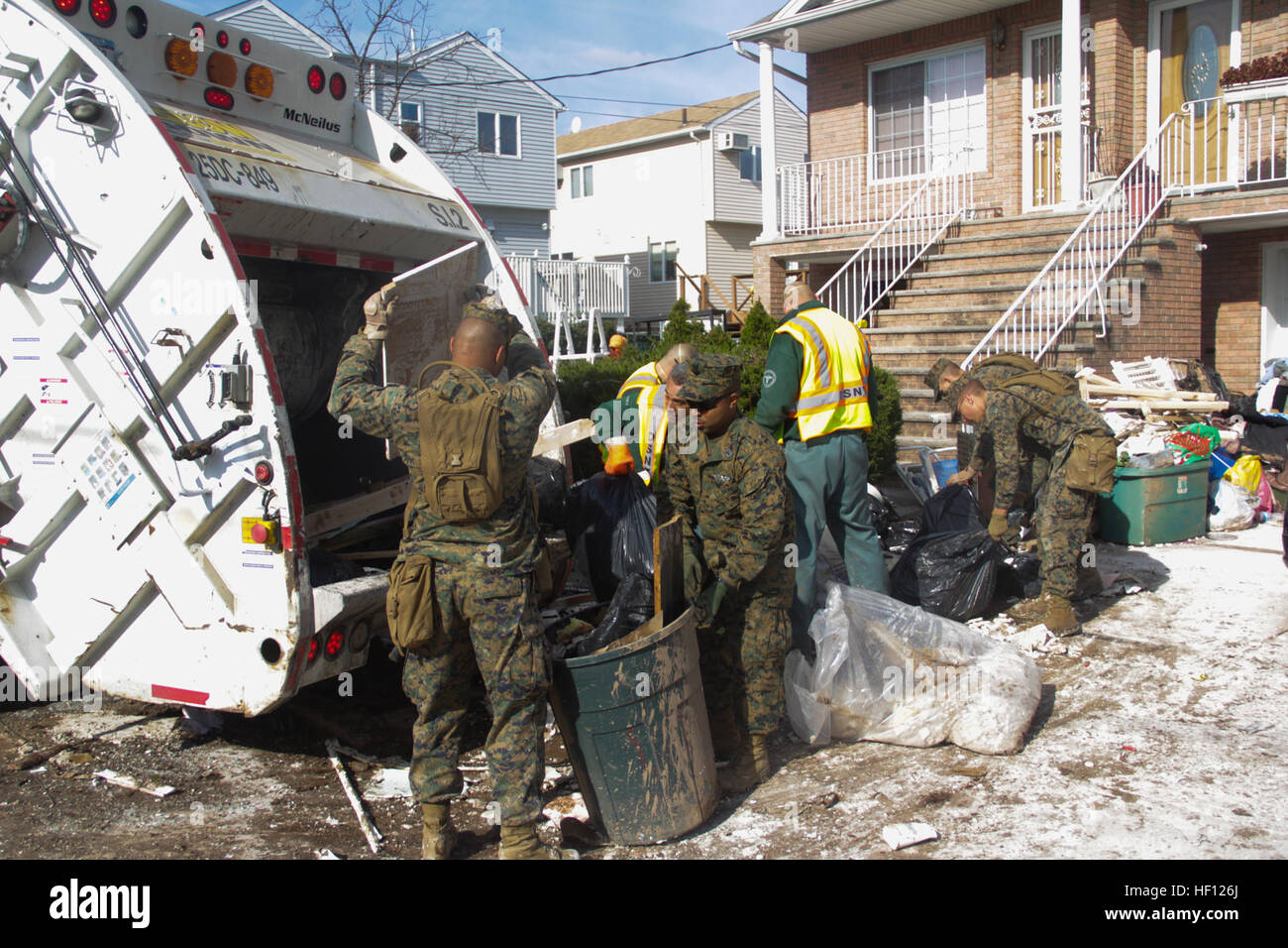 Marines of the 26th Marine Expeditionary Unit work with members of the