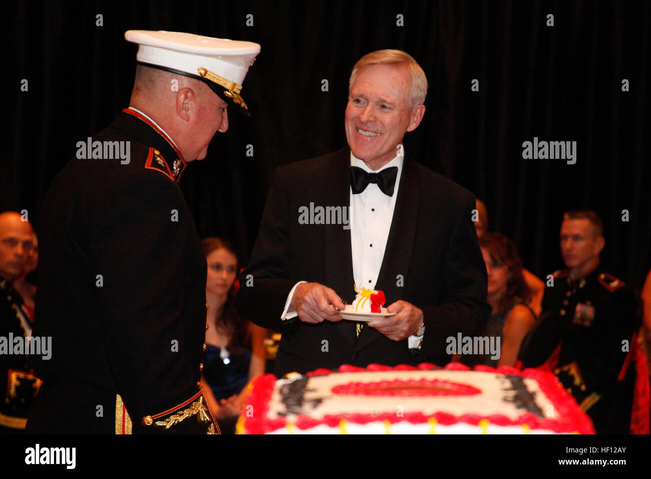 Maj. Gen. Glenn M. Walters, left, commanding general of 2nd Marine Aircraft Wing, hands Secretary of the Navy Ray Mabus a piece of the Marine Corps birthday cake during the wing's 237th Marine Corps birthday ball celebration in New Bern. Mabus said the night was all about celebrating history, tradition and heritage. Marine Corps Air Station Cherry Point Year In Review 121107-M-AF823-060 Stock Photo