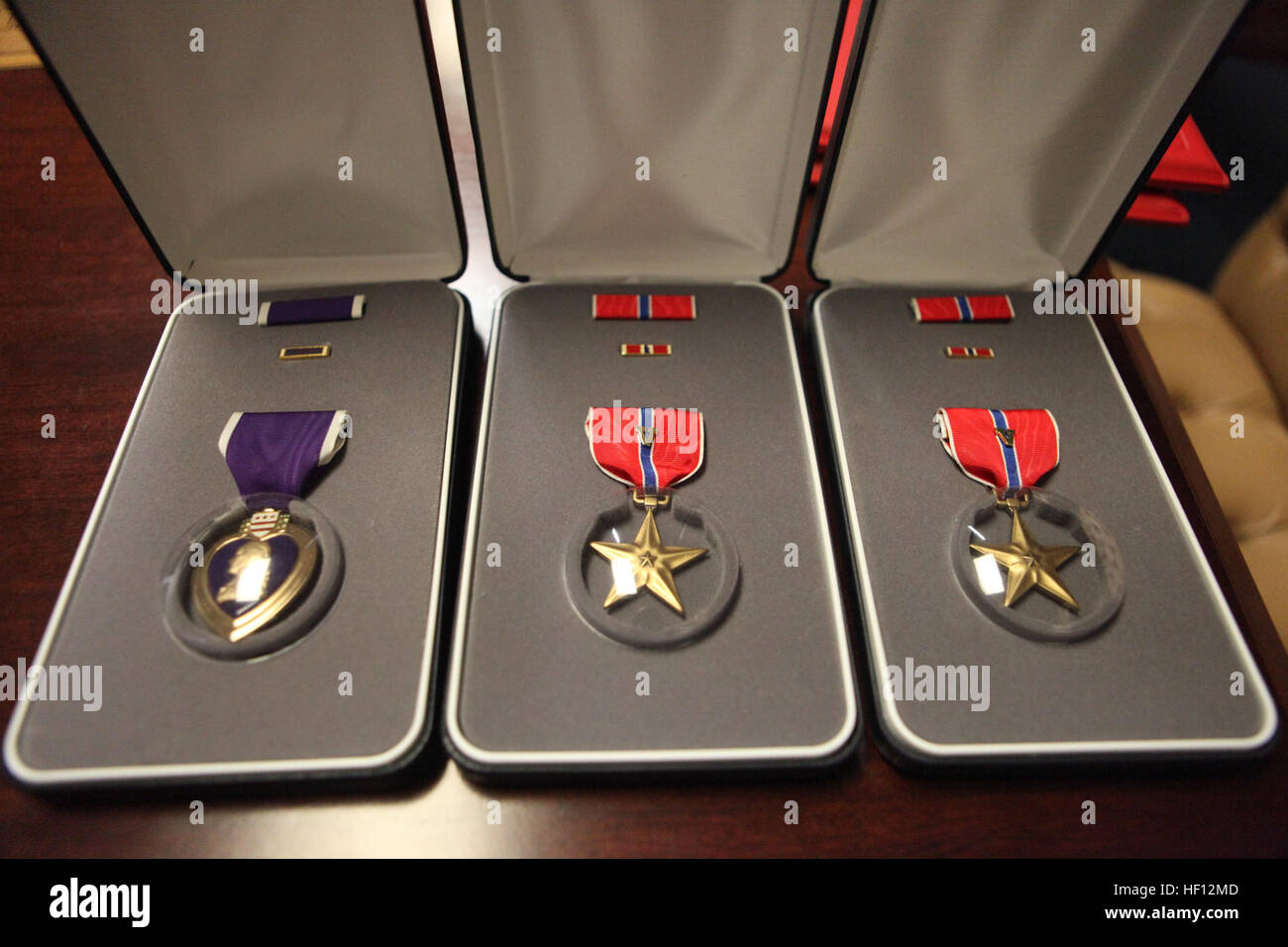 A Purple Heart and two Bronze Star medals are displayed at U.S. Marine