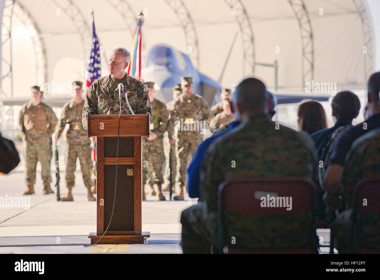 Gen. James Amos, Commandant of the Marine Corps, speaks of the importance of the F-35B to the Marine Corps and the Department of Defense during the re-designation ceremony of Marine Fighter Attack Squadron 121, at Marine Corps Air Station Yuma, Nov. 20.  VMFA-121 is an important milestone for the Marine Corps and the Department of Defense as the F-35 expands from a testing and training aircraft towards full-scale tactical aviation operations.  The quick sortie turnaround of the Marine Corps' aircraft forward, expeditionary airfields with shorter runways has changed the tempo of battle in our f Stock Photo