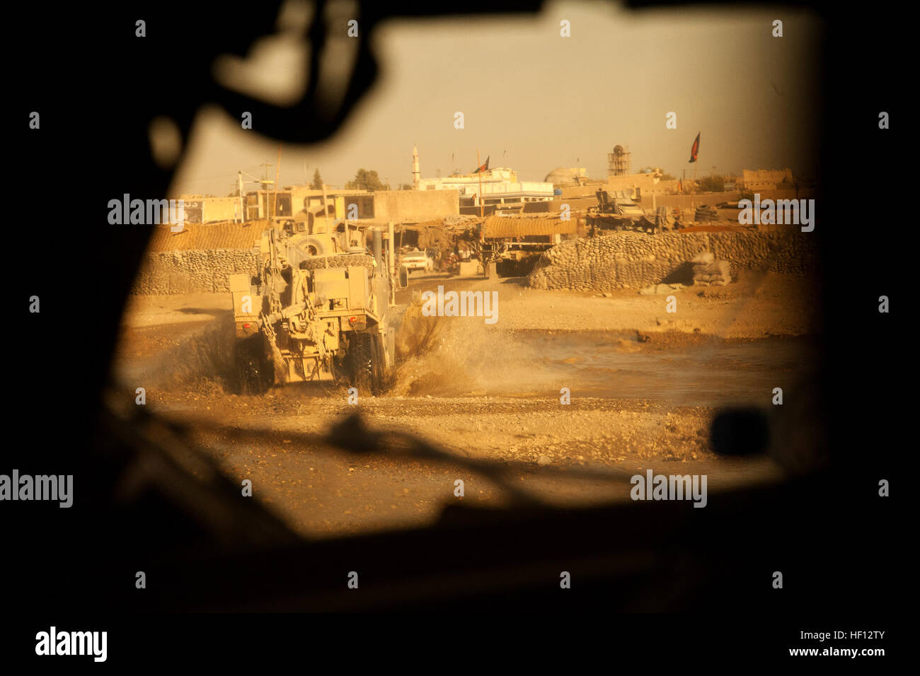 U.S. Marines assigned to Motor Transport Platoon, Fox Company, 2nd Battalion, 7th Marine Regiment (2/7), conduct a convoy mission in Helmand province, Afghanistan, Nov. 26, 2012. The Marines of 2/7 deployed to Afghanistan in support of Operation Enduring Freedom. (U.S. Marine Corps photo by Cpl. Alejandro Pena/Released) Motor-T Platoon Convoy 121126-M-YH552-495 Stock Photo
