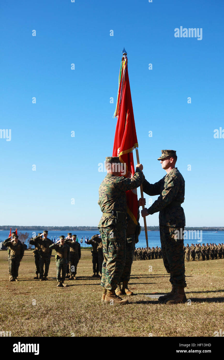 Col. Gary F. Keim (left), the new commander of Combat Logistics Regiment 27, 2nd Marine Logistics Group, receives the regimental colors from Col. Mark R. Hollahan, CLR-27's outgoing commanding officer, during the unit's change of command ceremony aboard Camp Lejeune, N.C., Dec. 14, 2012. Hollahan departed the regiment after spending more than two years with the unit. Combat Logistics Regiment 27 welcomes new commanding officer 121214-M-UV027-095 Stock Photo