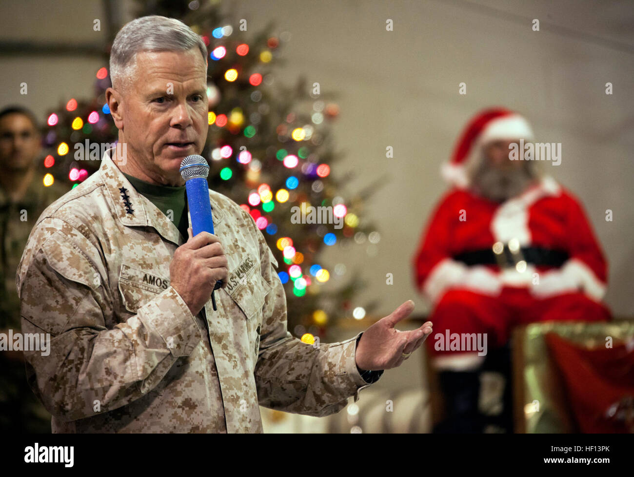 U.S. Marine Corps Gen. James F. Amos, left, the commandant of the Marine Corps, speaks to Service members during a Christmas Eve show at Camp Leatherneck, Helmand province, Afghanistan, Dec. 24, 2012. (DoD photo by Staff Sgt. Ezekiel R. Kitandwe, U.S. Marine Corps/Released) 121224-M-RO295-027 (8314418249) Stock Photo