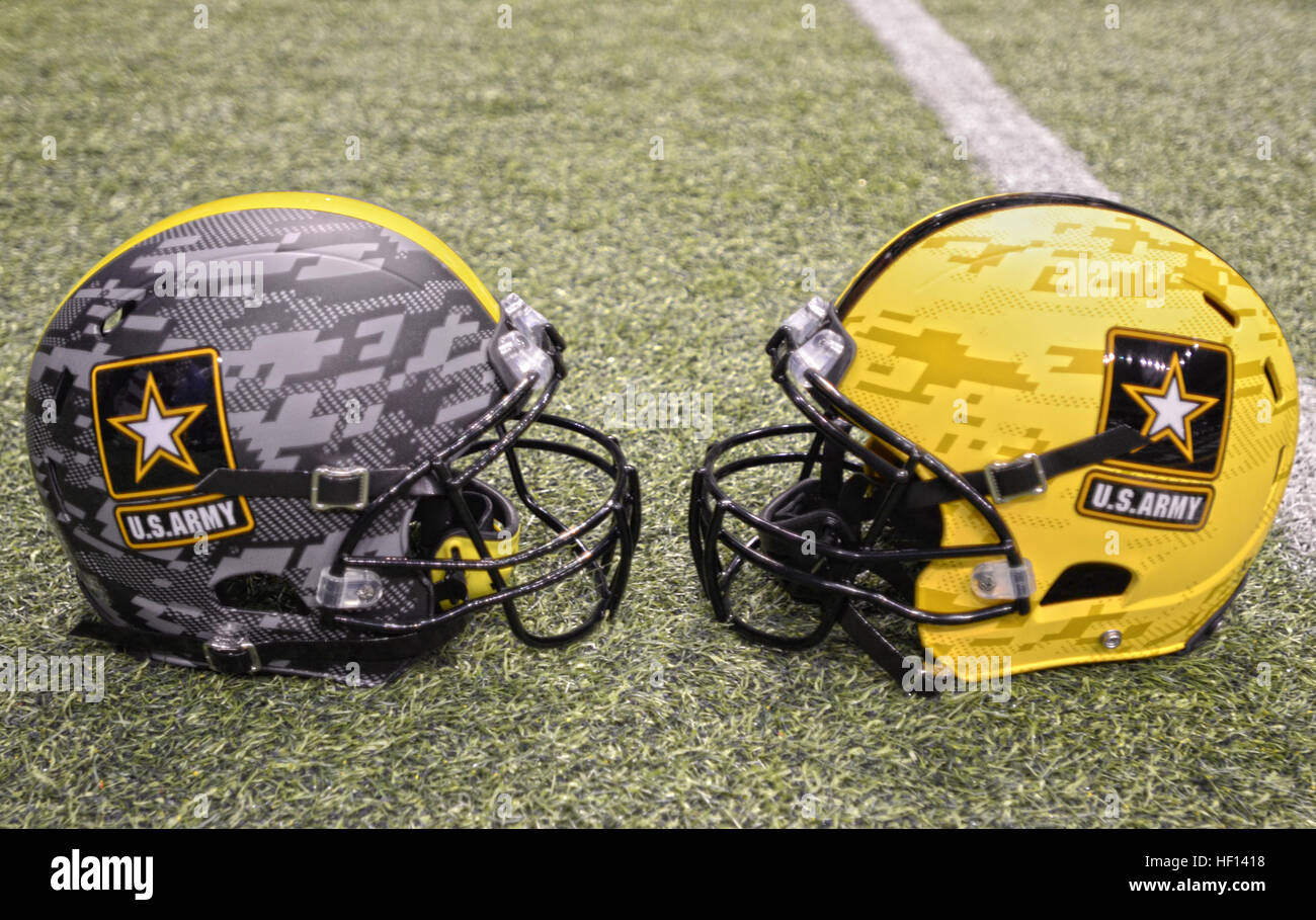 Two U.S. Army football helmets, representing both teams participating in the 2013 U.S. Army All-American Bowl, were on display at the Alamodome in San Antonio Jan. 3, 2013. The displays were set up during a Texas-style barbecue dinner welcoming soldiers, student athletes and musicians, and their families. During the dinner, top high school marching band musicians, teachers and community members were recognized with awards for their accomplishments. The Army has hosted the All-American Bowl in San Antonio since 2002, highlighting the 90 best high school football players and 125 best high school Stock Photo